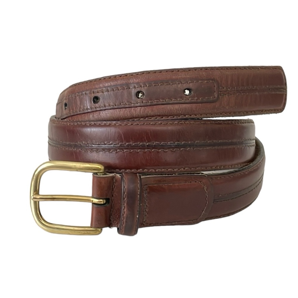 Brown leather belt with center‎ stitch details. Size 32.  Solid brass buckle.